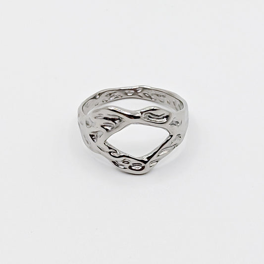 Textured stainless steel ring with an open cutouts on a white background.