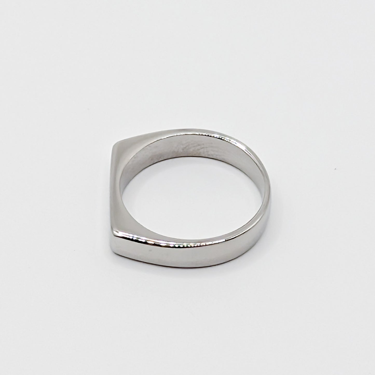 Flat bar stainless steel signet ring in different orientation.