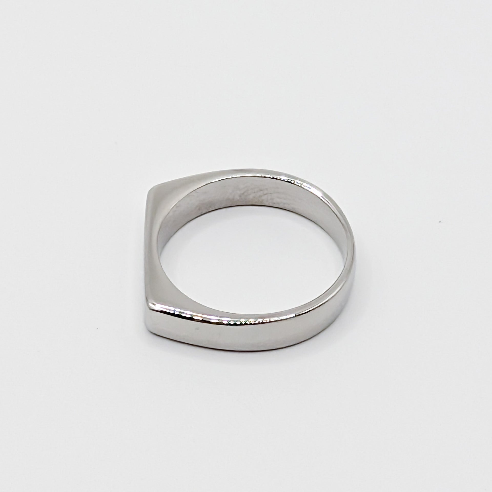 Flat bar stainless steel signet ring in different orientation.