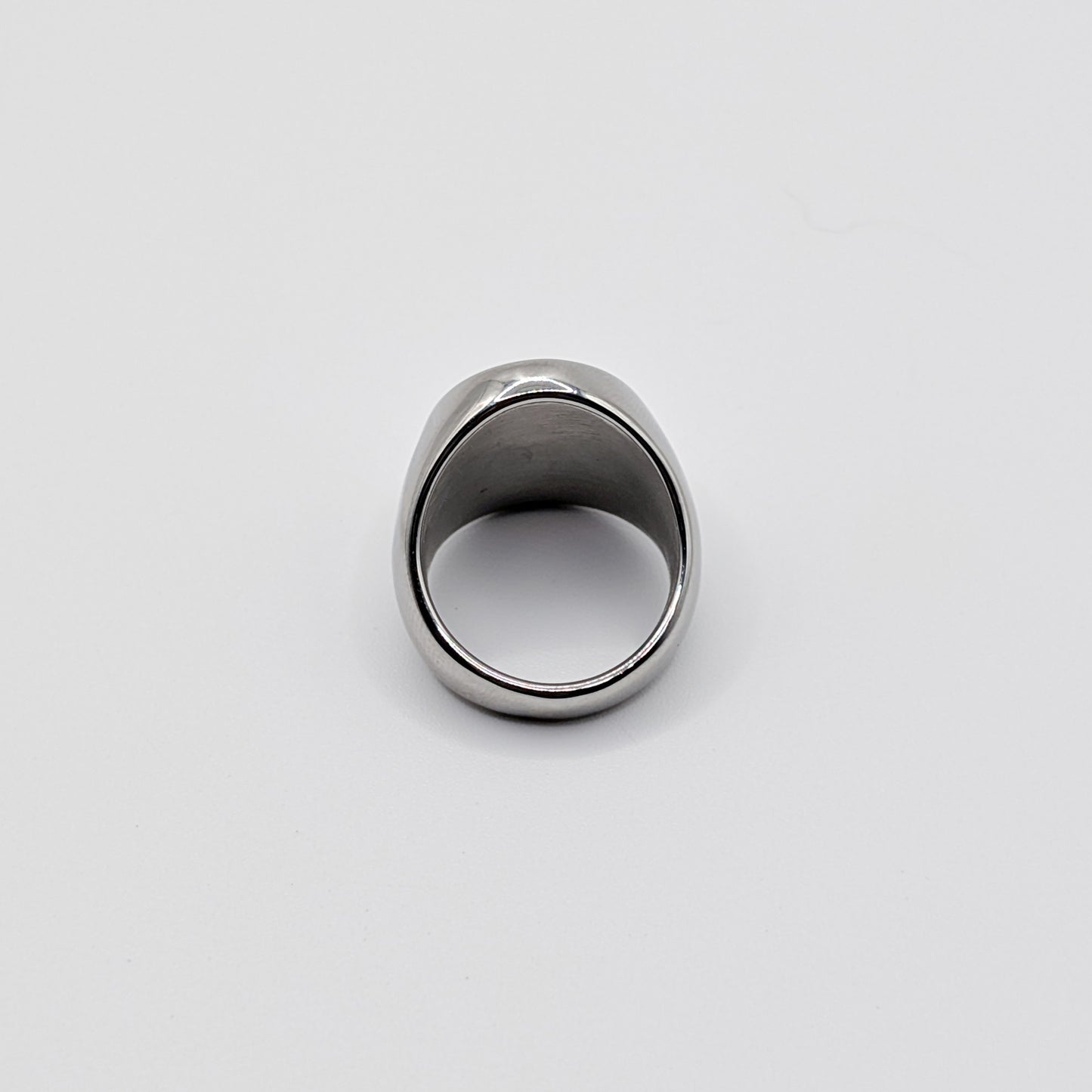 Alternative angle of thick stainless steel signet ring from the back perspective