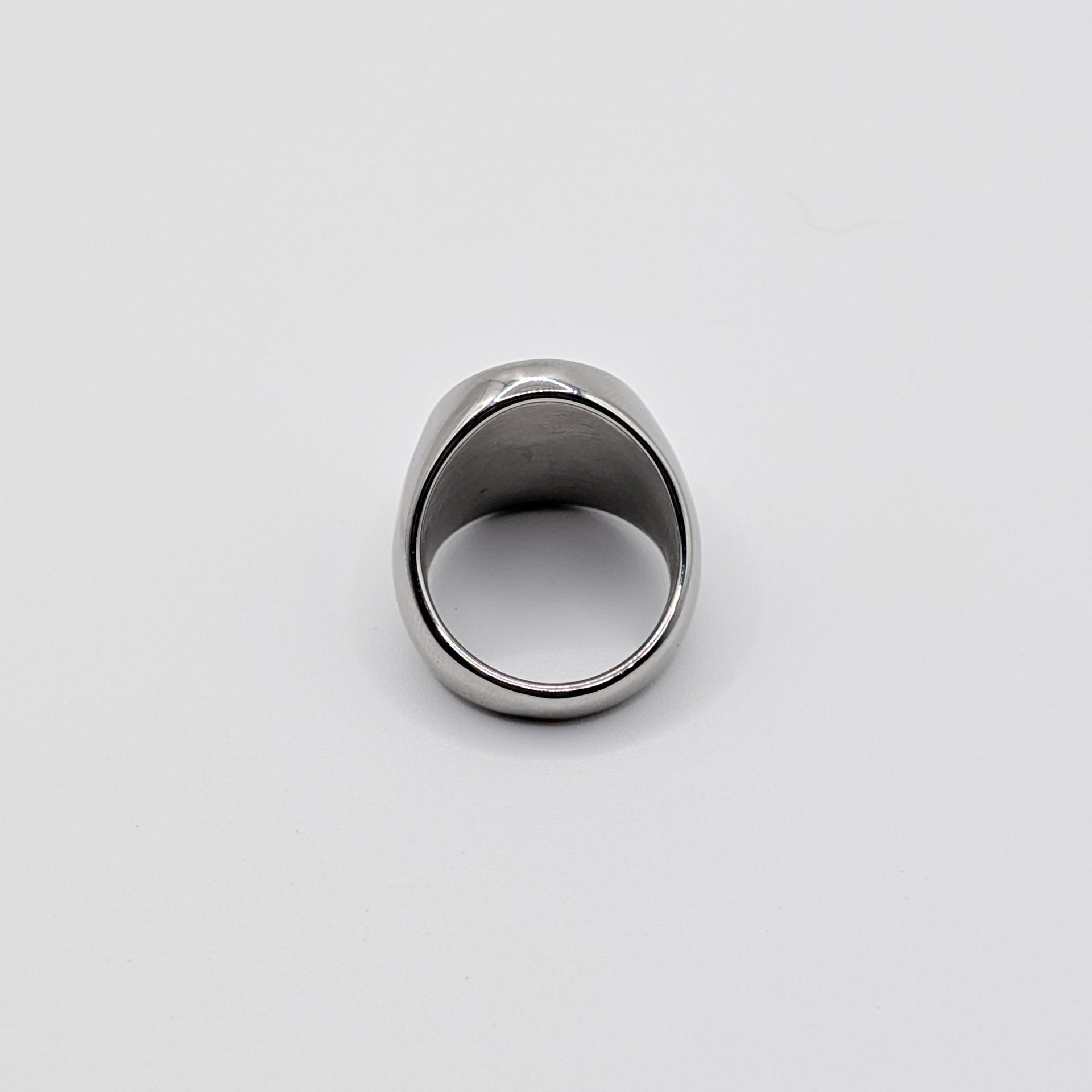 Alternative angle of thick stainless steel signet ring from the back perspective