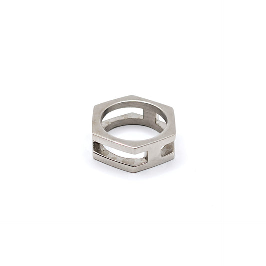 A silver-toned geometric ring with a hexagonal shape and openwork cutouts, shown on a plain white background.