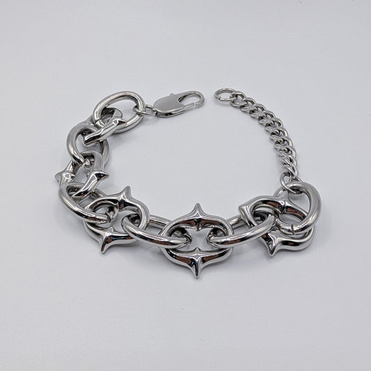 A silver-toned metal chain bracelet with large interlocking links and a lobster clasp, photographed on a plain light background.